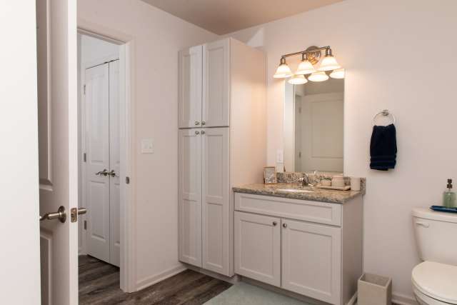 Large bathrooms with vanity, walk in showers, emergency pull cords, and ample storage.
